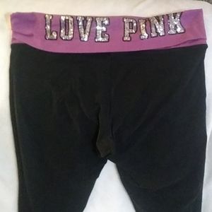 Pink yoga pants size large bling logo.
